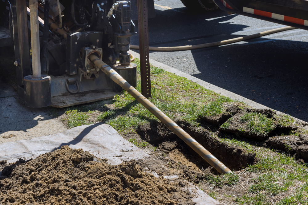 Trenchless sewer repair being performed on Dallas, TX street.